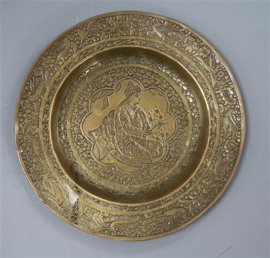 A 19th century Persian hand embossed brass dish